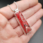 Fordite pendant